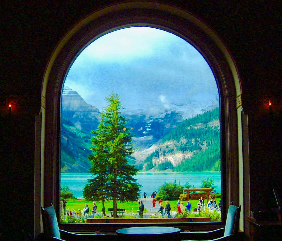 Great View from The Lakeview Lounge of mountains, lake, and trees.